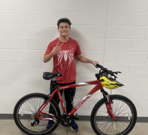 Alan with his new bike, he is the 10,000th bike recipient