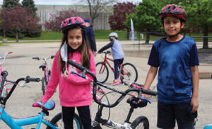 Sister and brother get new bikes.