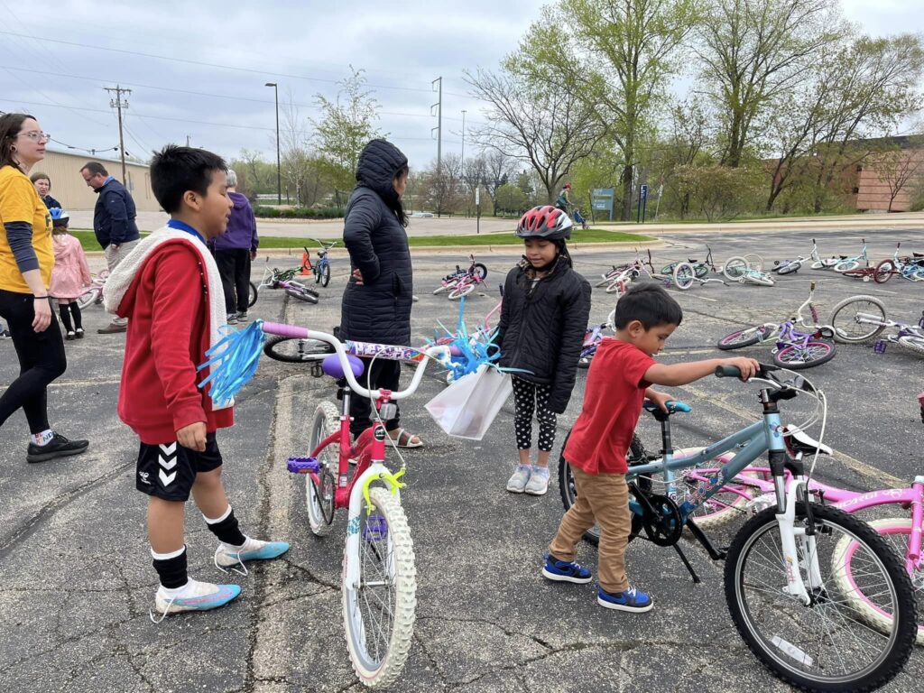 parking lot of kids shopping for bikes