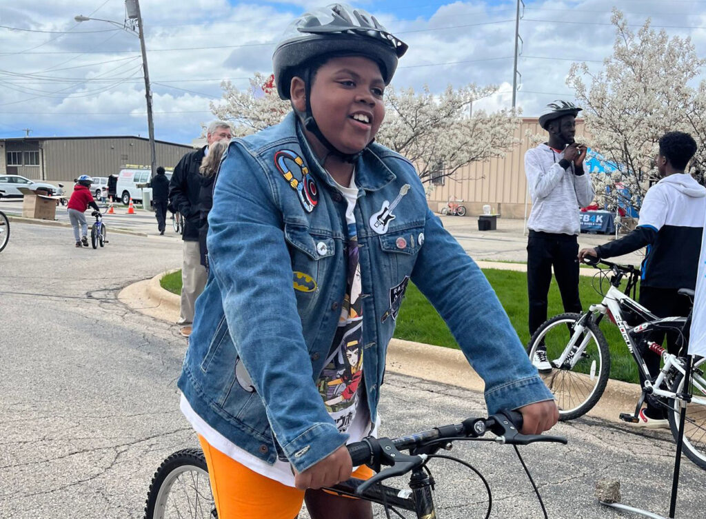 happy boy smiling on new bike 2023