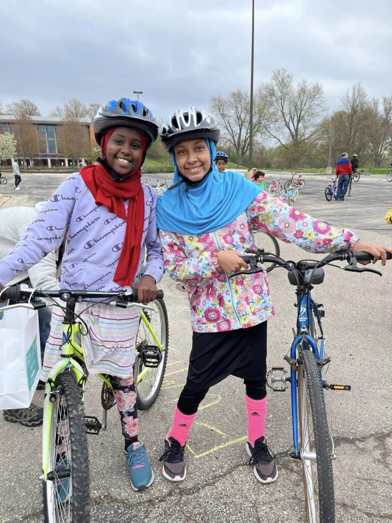 two girls happy with bikes