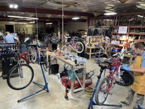 People working on bikes in the bike center