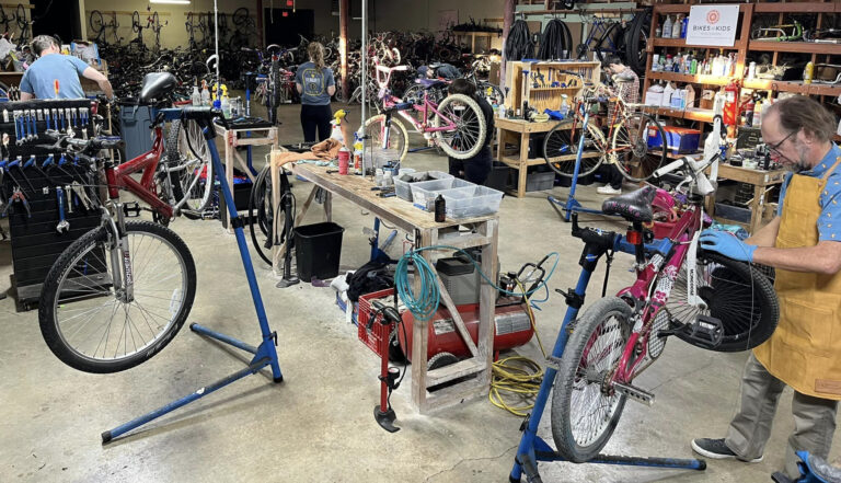 Members working on bikes in the bike center